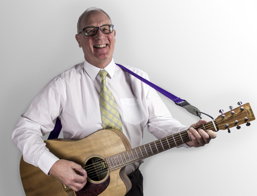 Dave with guitar shirt and tie